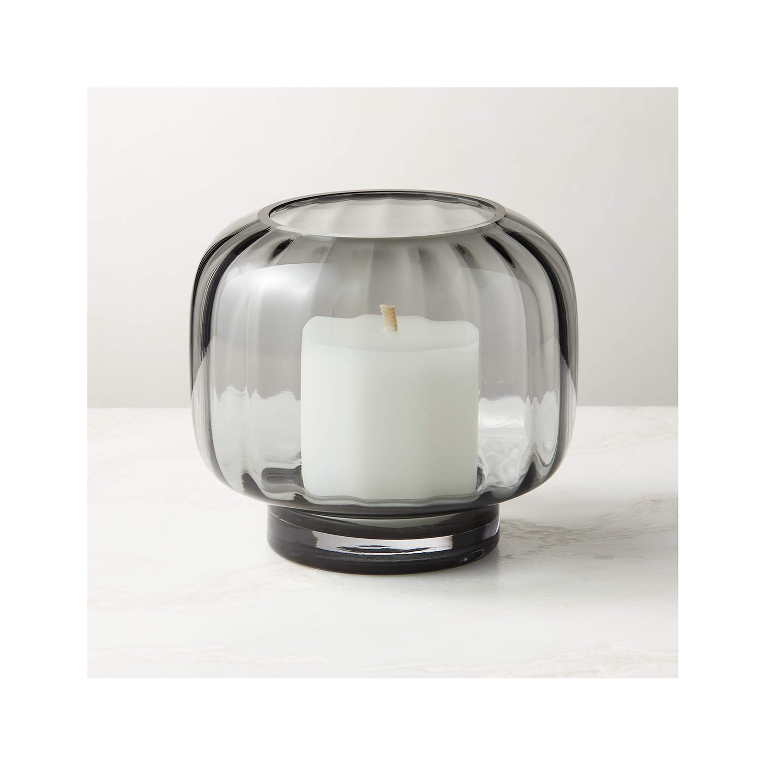 http://cdn.apartmenttherapy.info/image/upload/v1683838196/at/style/cb2-ribbed-hurricane-candle-holder.jpg