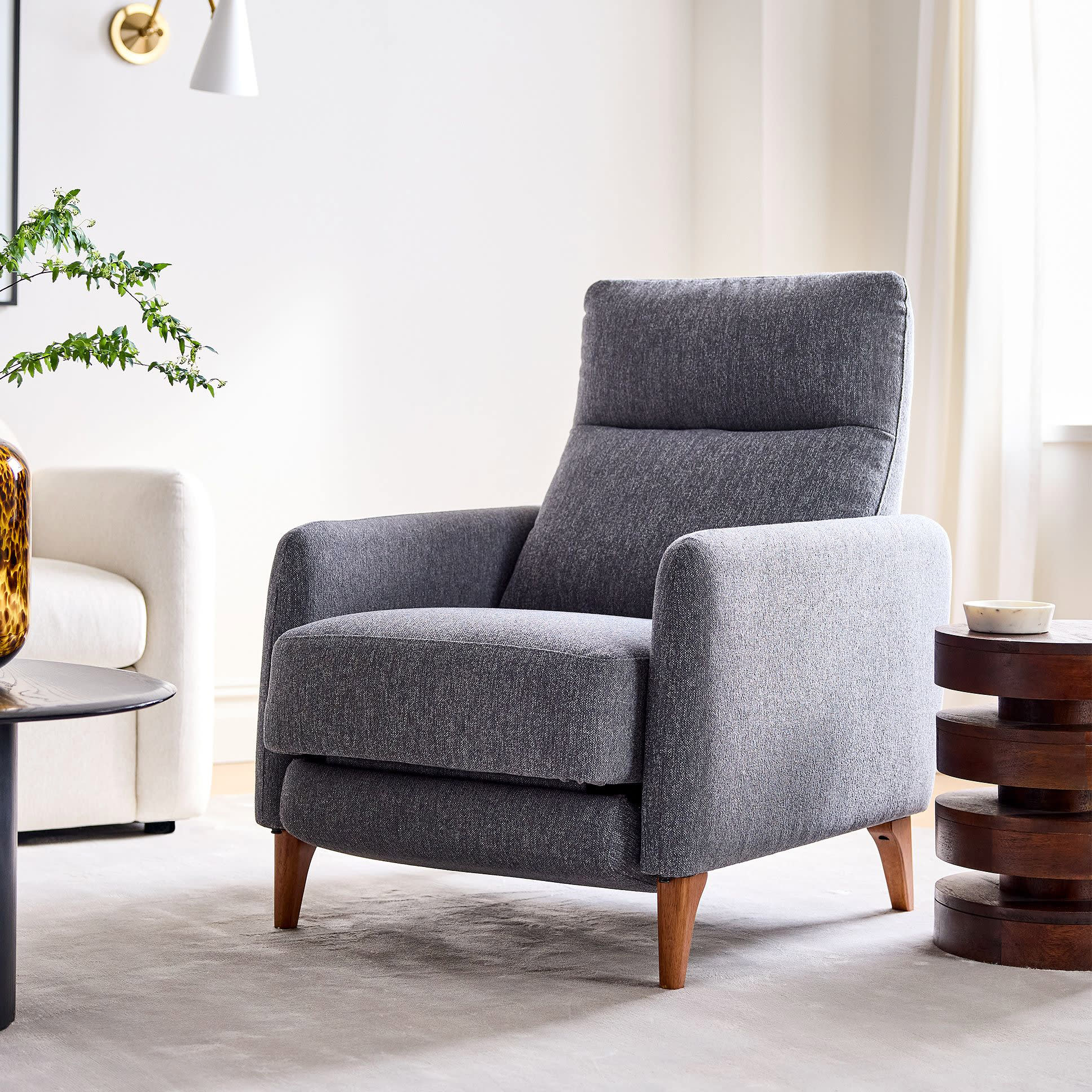http://cdn.apartmenttherapy.info/image/upload/v1687366939/commerce/product-roundups/2023/2023-06-comfortable-chairs-small-spaces/west-elm-auburn-recliner.jpg