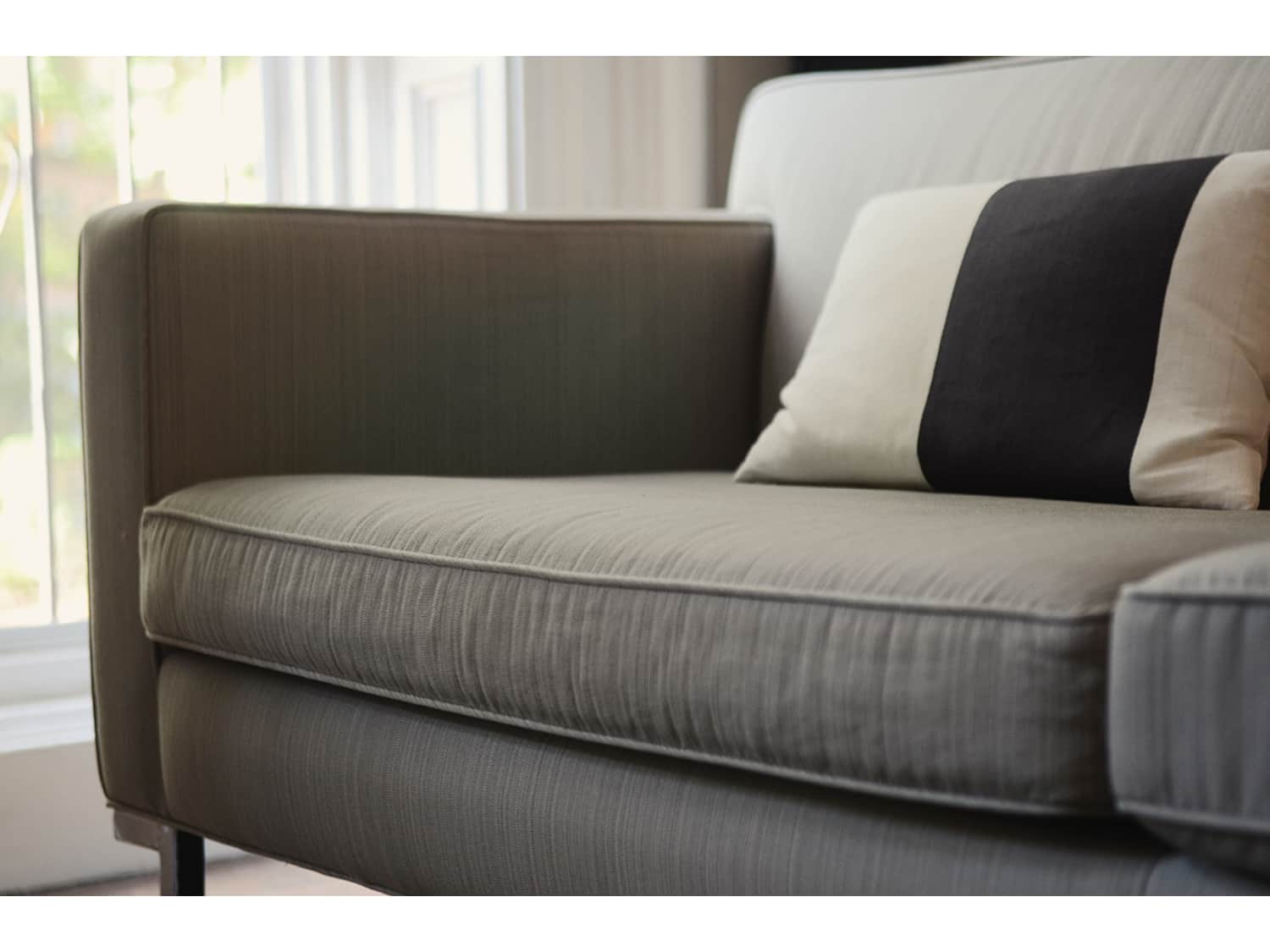 DWR Theatre Sofa in gray tweed fabric Apartment Therapy