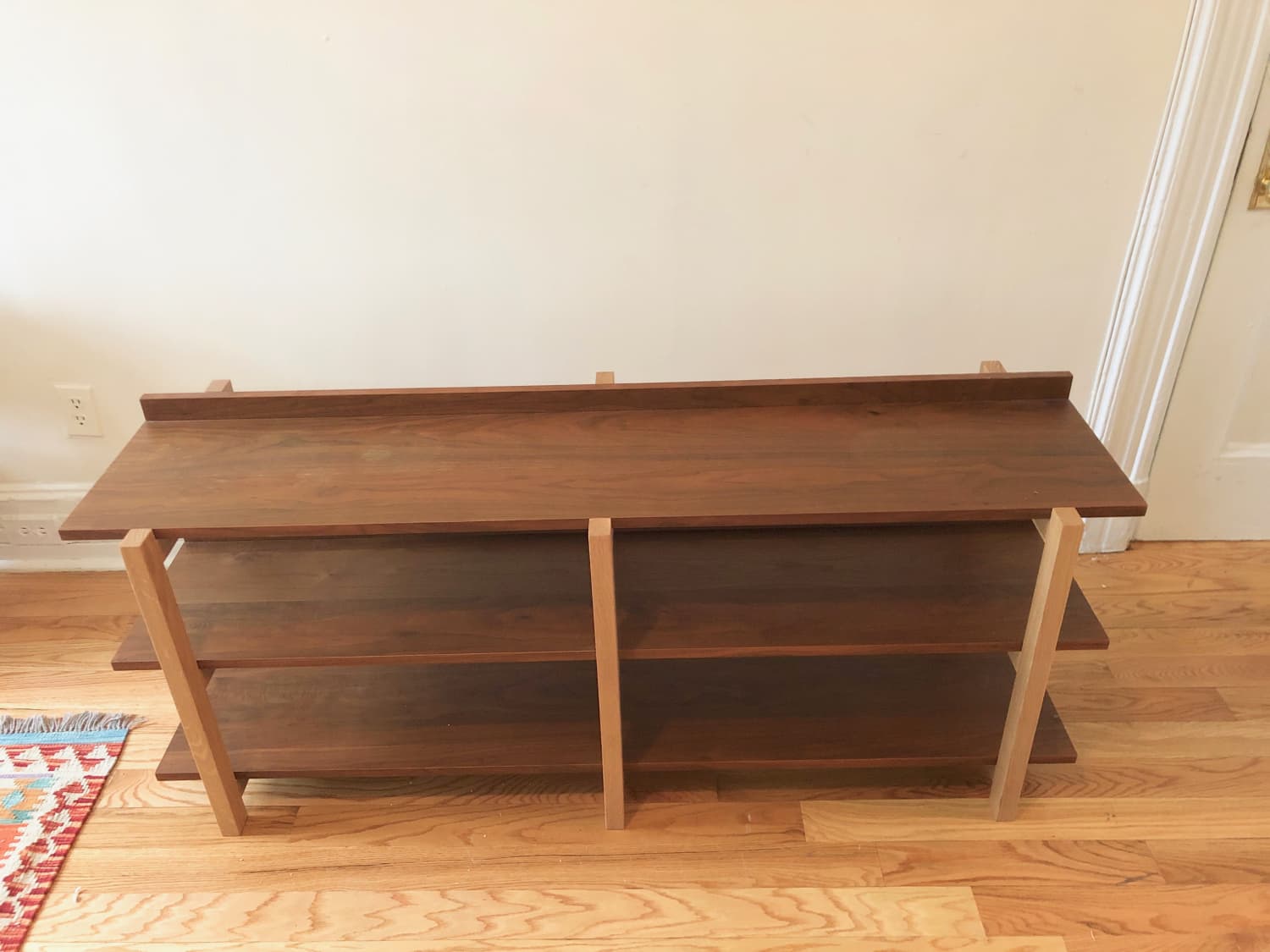 Cb2 Stax Console Shelving Bookcase Apartment Therapy S Bazaar Envisioned by british designer steuart padwick, this open construction showcases the natural beauty of black walnut veneer floating in a vertical rise on contrasting frame of solid white oak. cb2 stax console shelving bookcase