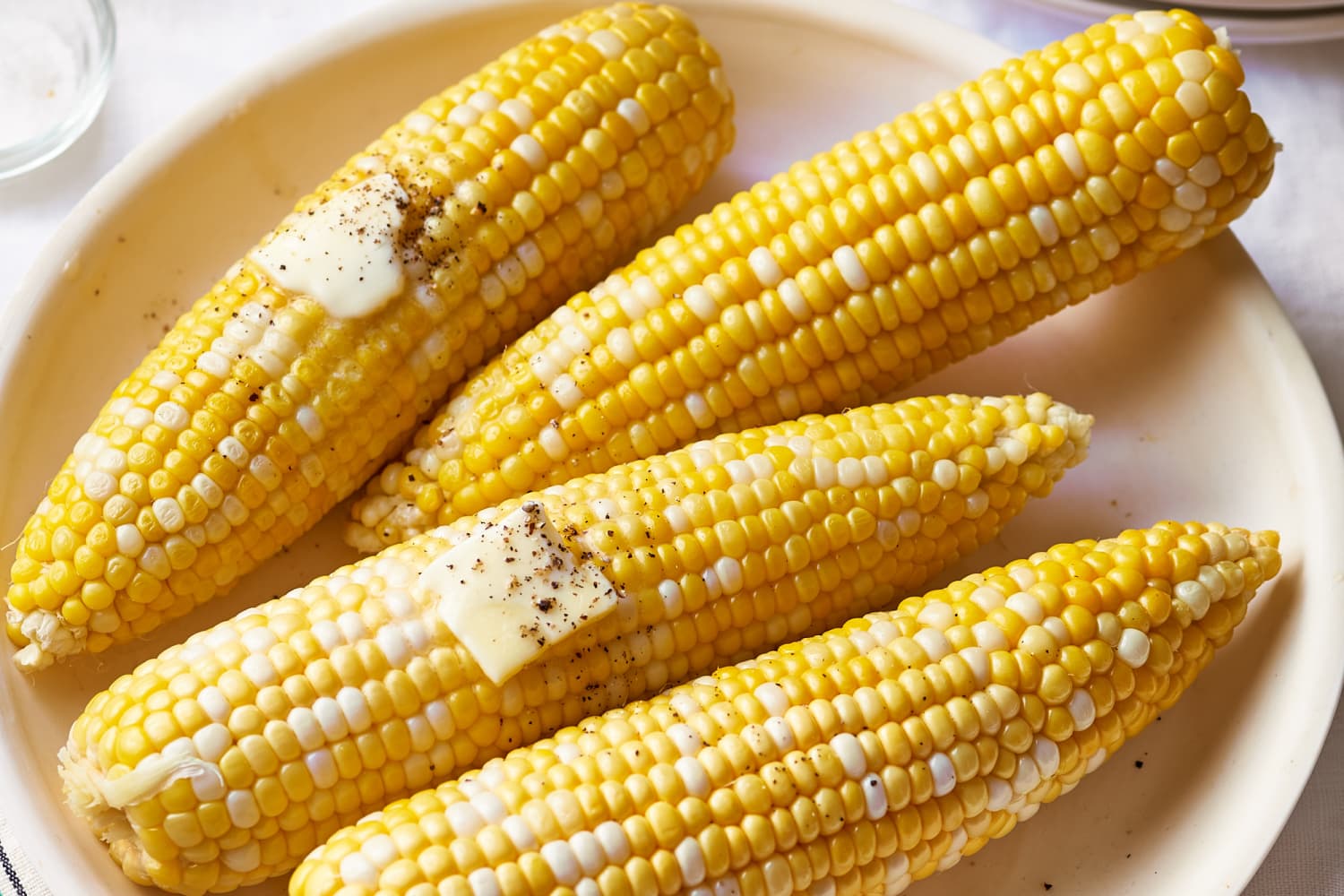 How To Cook Corn On The Cob In The Microwave Kitchn Place corn in microwave on a large plate or directly onto microwave plate. how to cook corn on the cob in the microwave