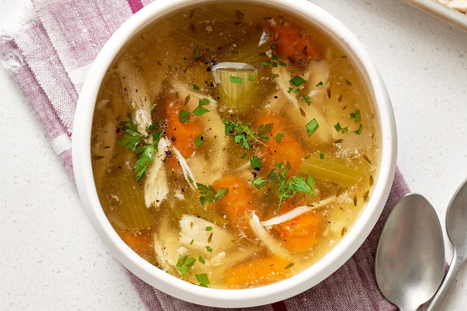 Slow Cooker Whole Chicken Soup Recipe (Hearty) - The Kitchn