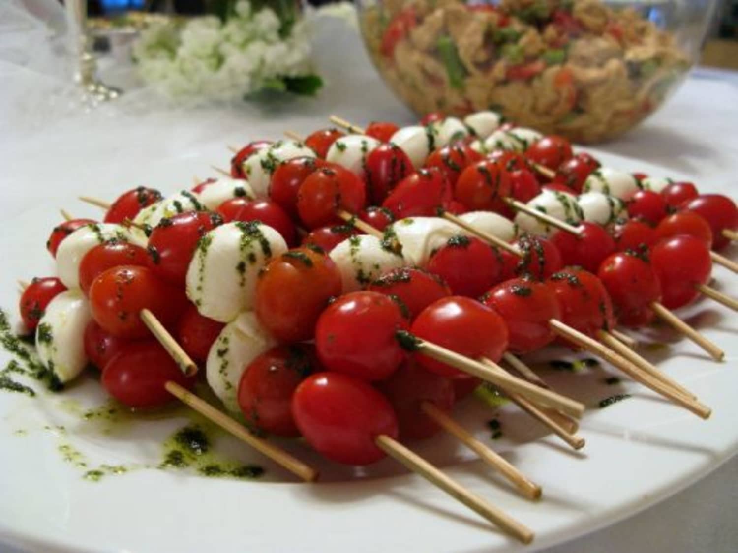 Appetizer Tomato and Mozzarella Skewers with Basil Oil