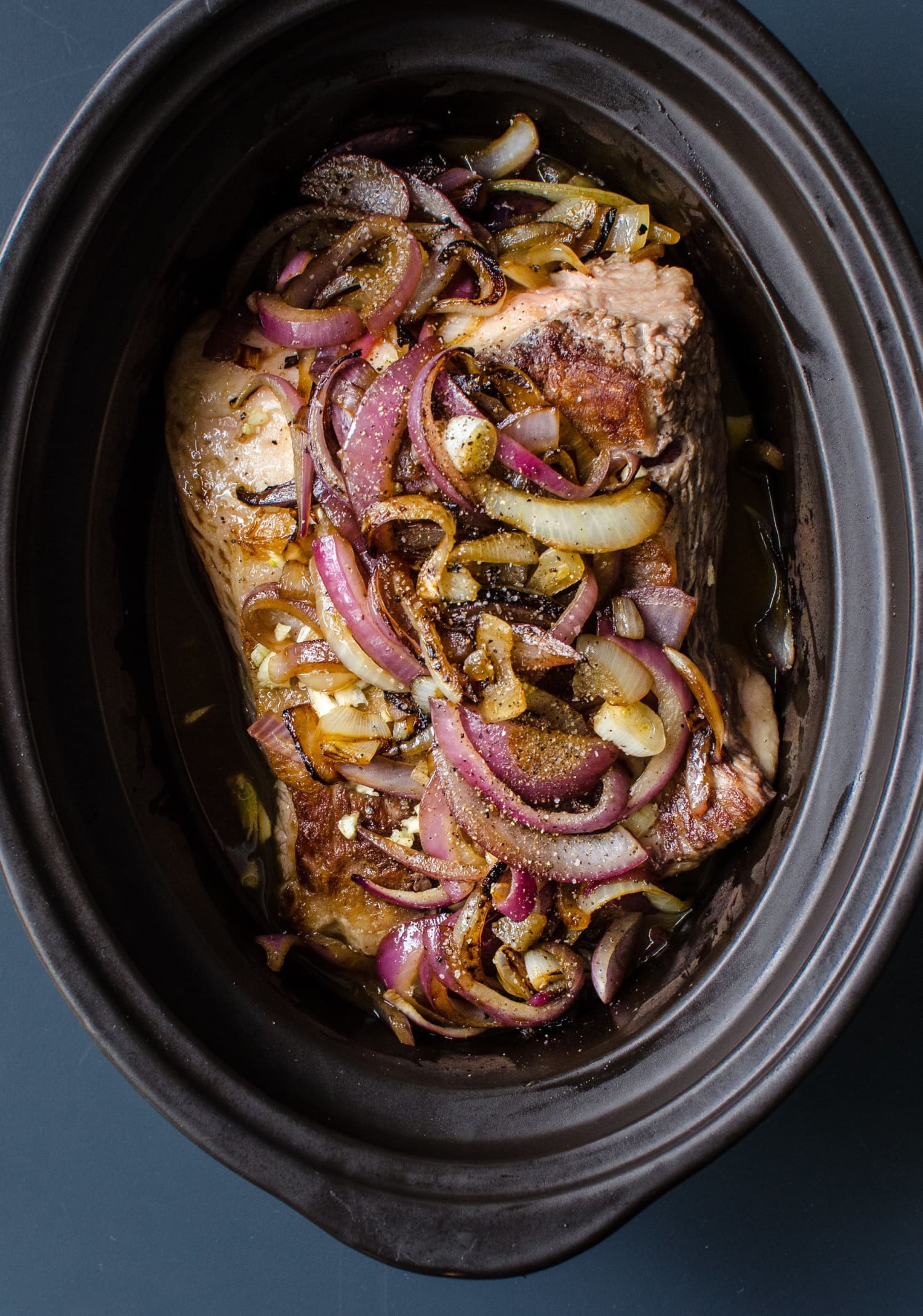 Easy Slow Cooker Brisket and Onions Recipe | Kitchn