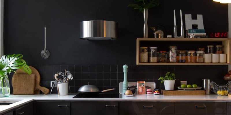 Black cabinets top with grey walls