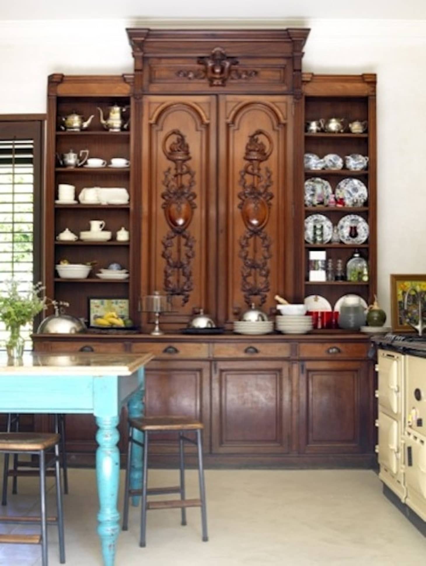 A Healthy Dose of Drama Kitchens that Use Antique Furniture in Lieu of WallHung