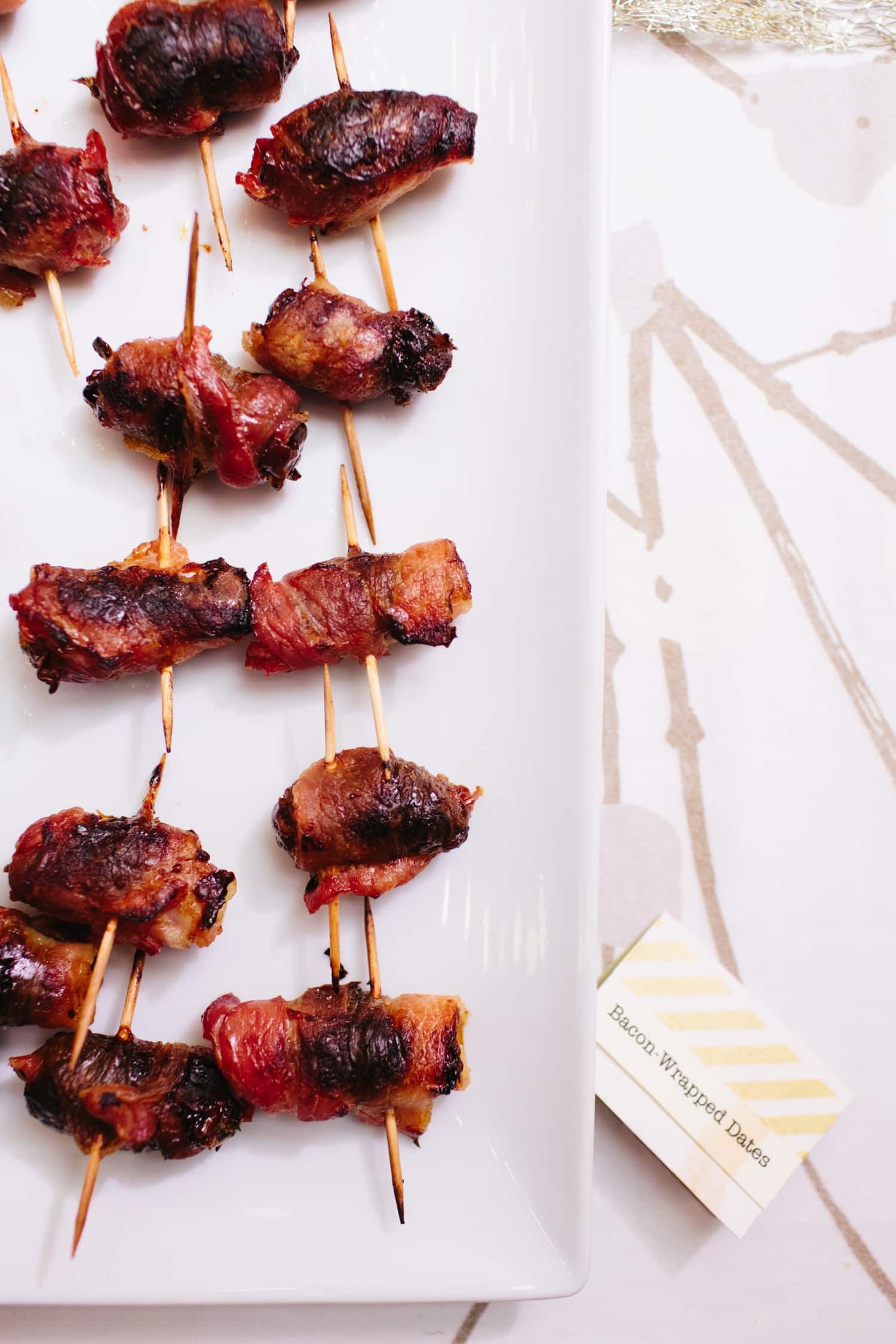 Party appetizer recipe bacon wrapped dates stuffed with almonds kitchn