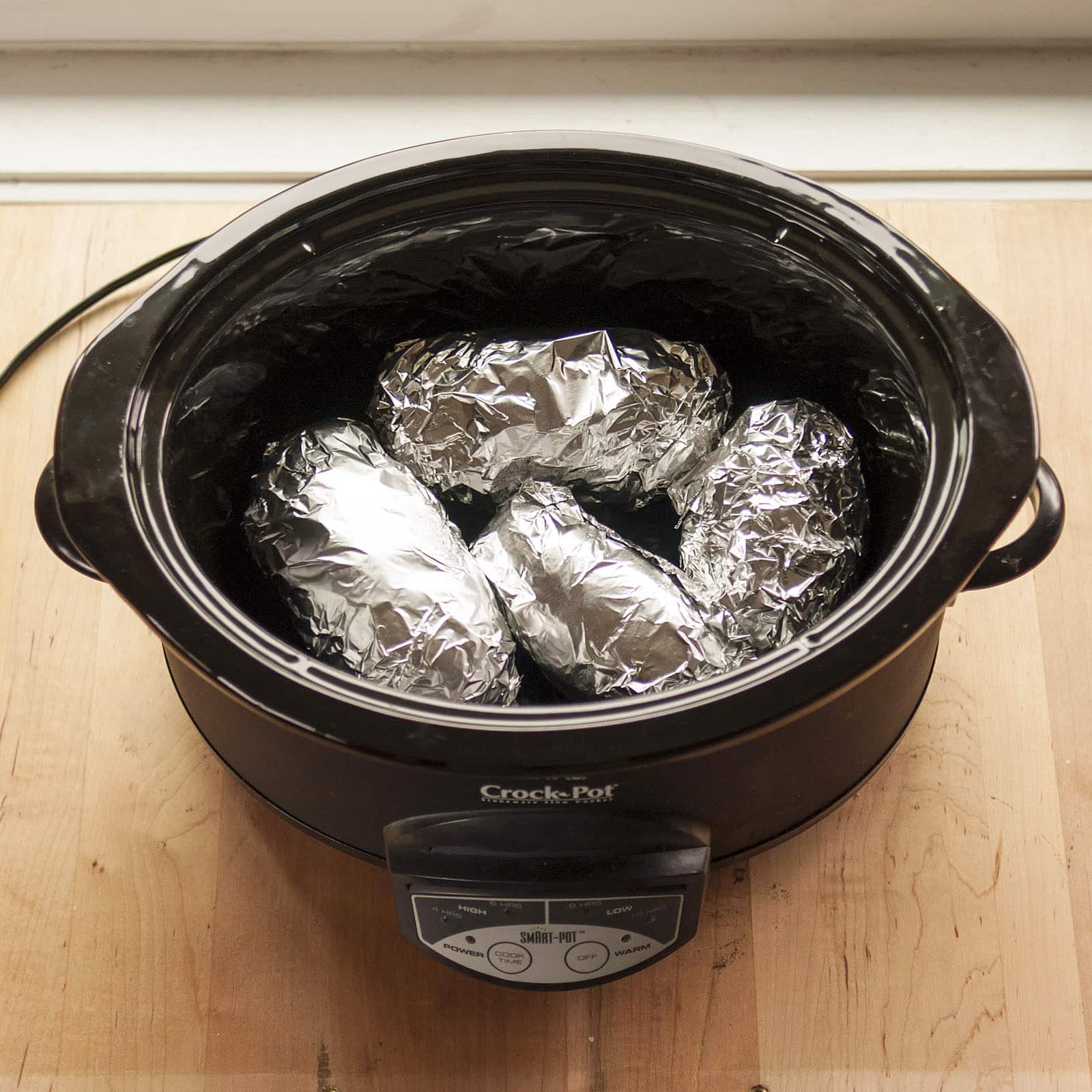 How To Bake a Potato in the Slow Cooker Kitchn