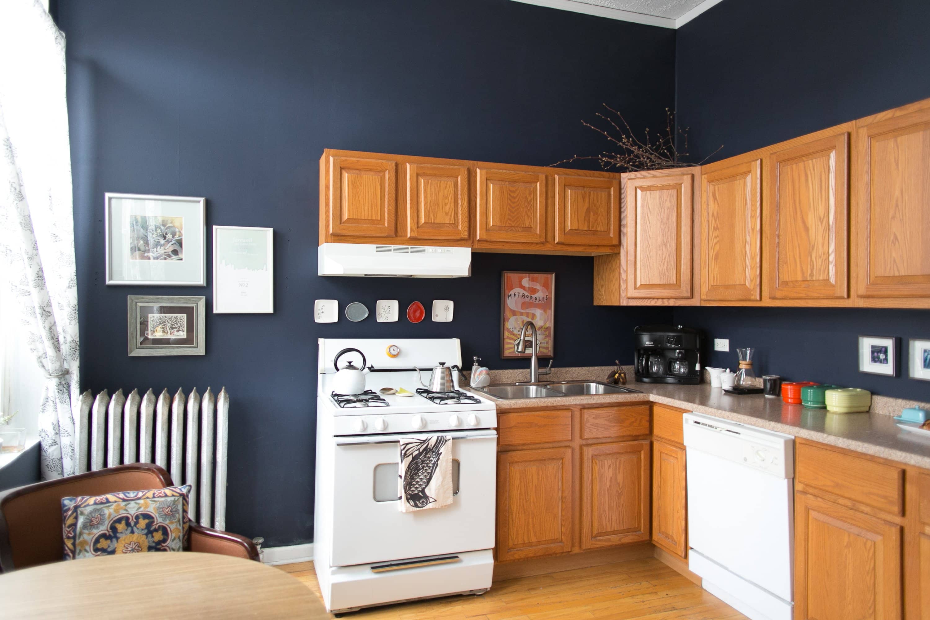 navy blue kitchen wall dark cabinet