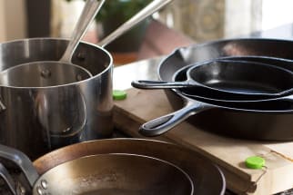 Hanging pots and pans on wall