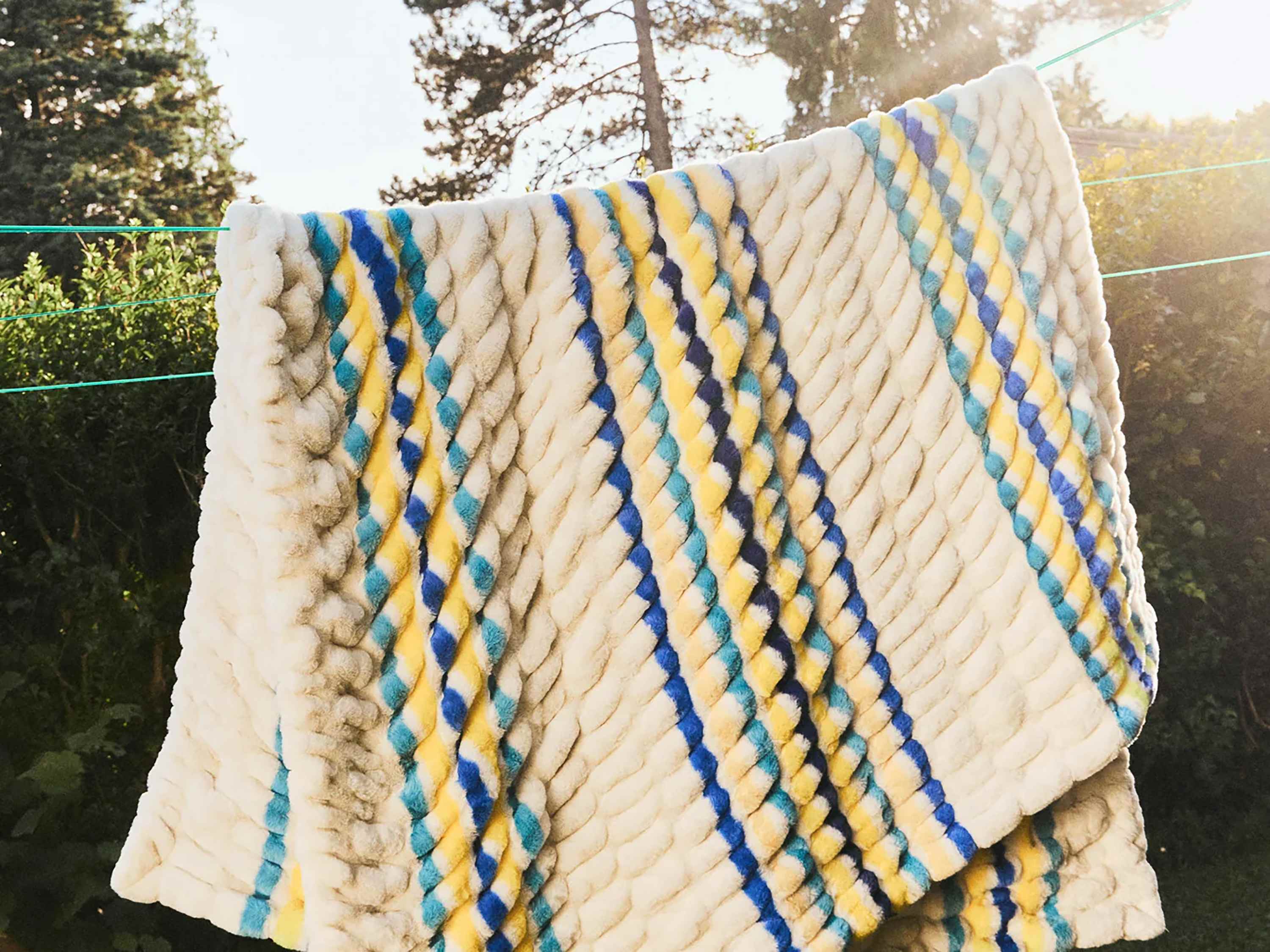 This Luxuriously Soft Blanket Is Just Like That Insta-Famous Option, But Less Expensive (and Comes in Stripes!)