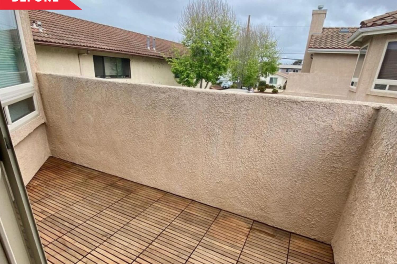 A Privacy Trick and Bold Colors Transformed a Bare, Exposed Concrete Balcony