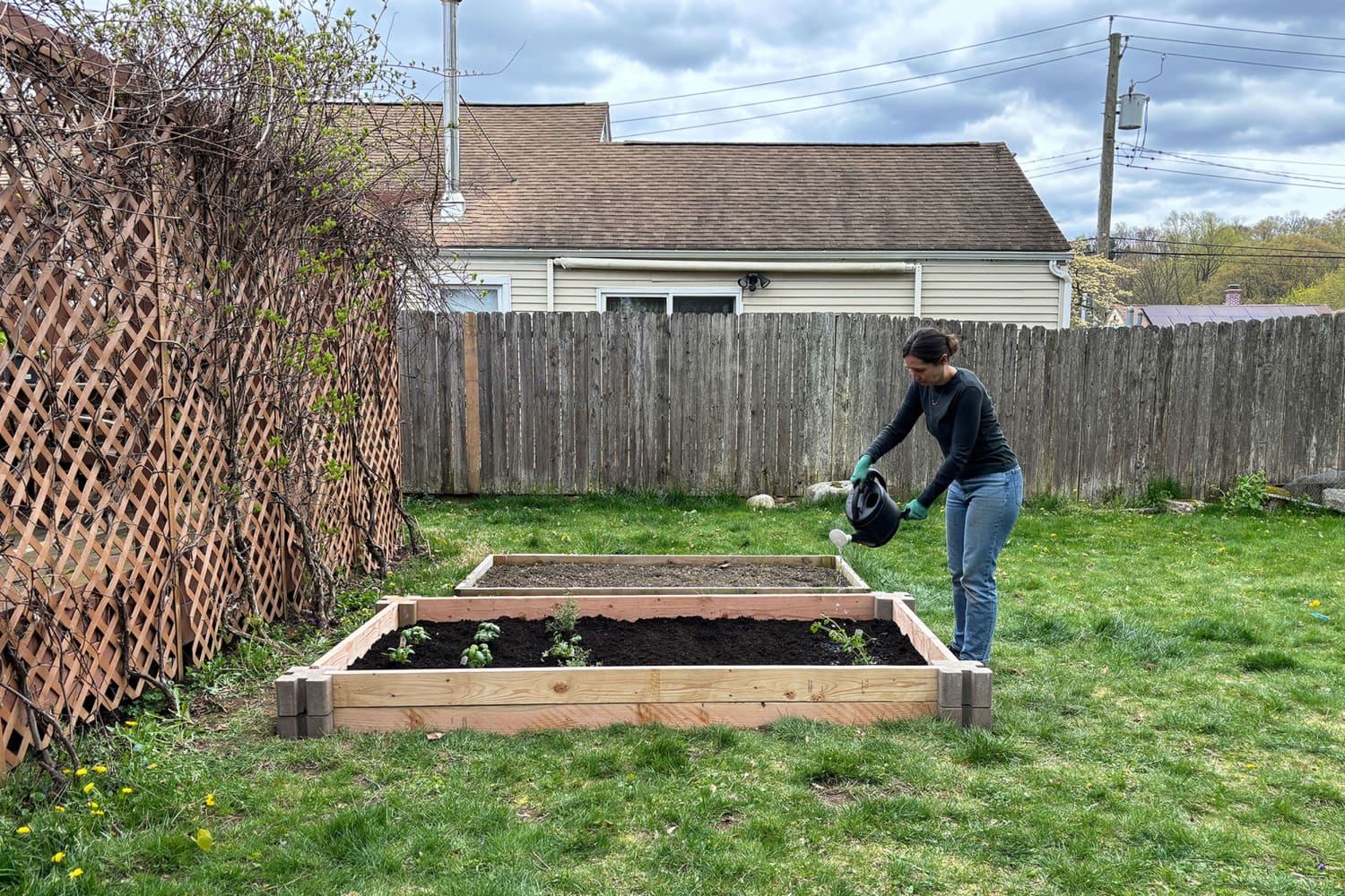 I Built a DIY Raised Garden Bed in My Sister's Yard for Less Than $200 (I Didn't Use Any Tools!)