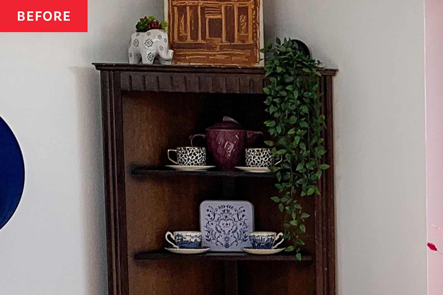 This Brown Corner Cabinet's Makeover Has the Coolest Idea for Leftover Wallpaper