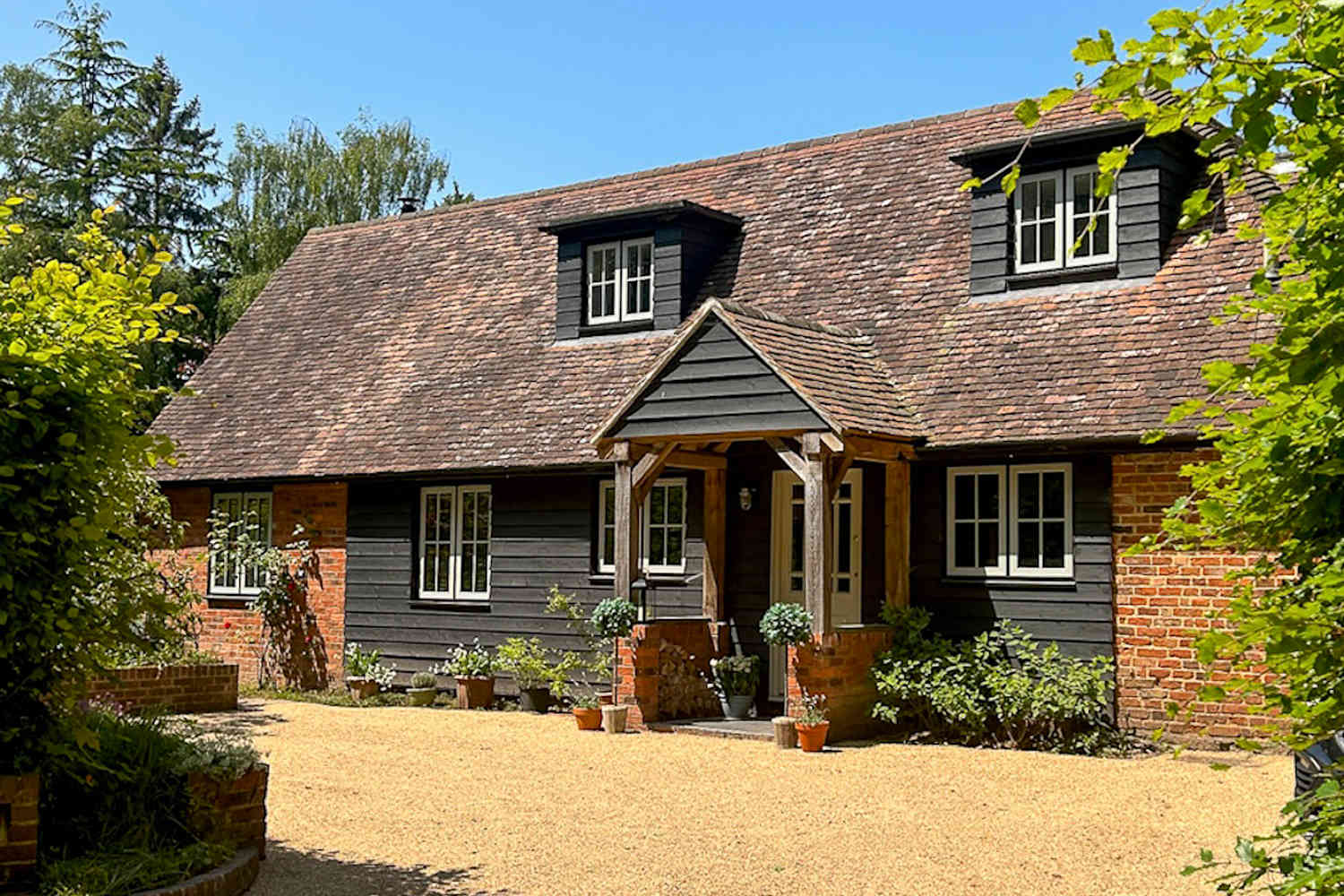 A 105-Year-Old Cottage Was "Ripped Apart to Its Bare Bones" To Turn Into a Cozy Oasis