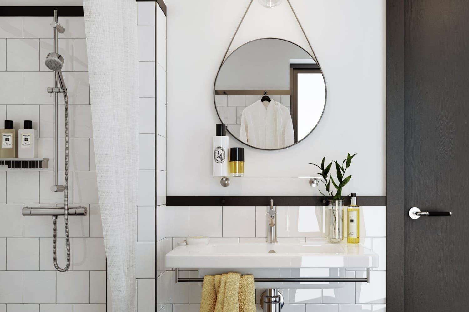 Круглое белое зеркало на белой плитке в ванной