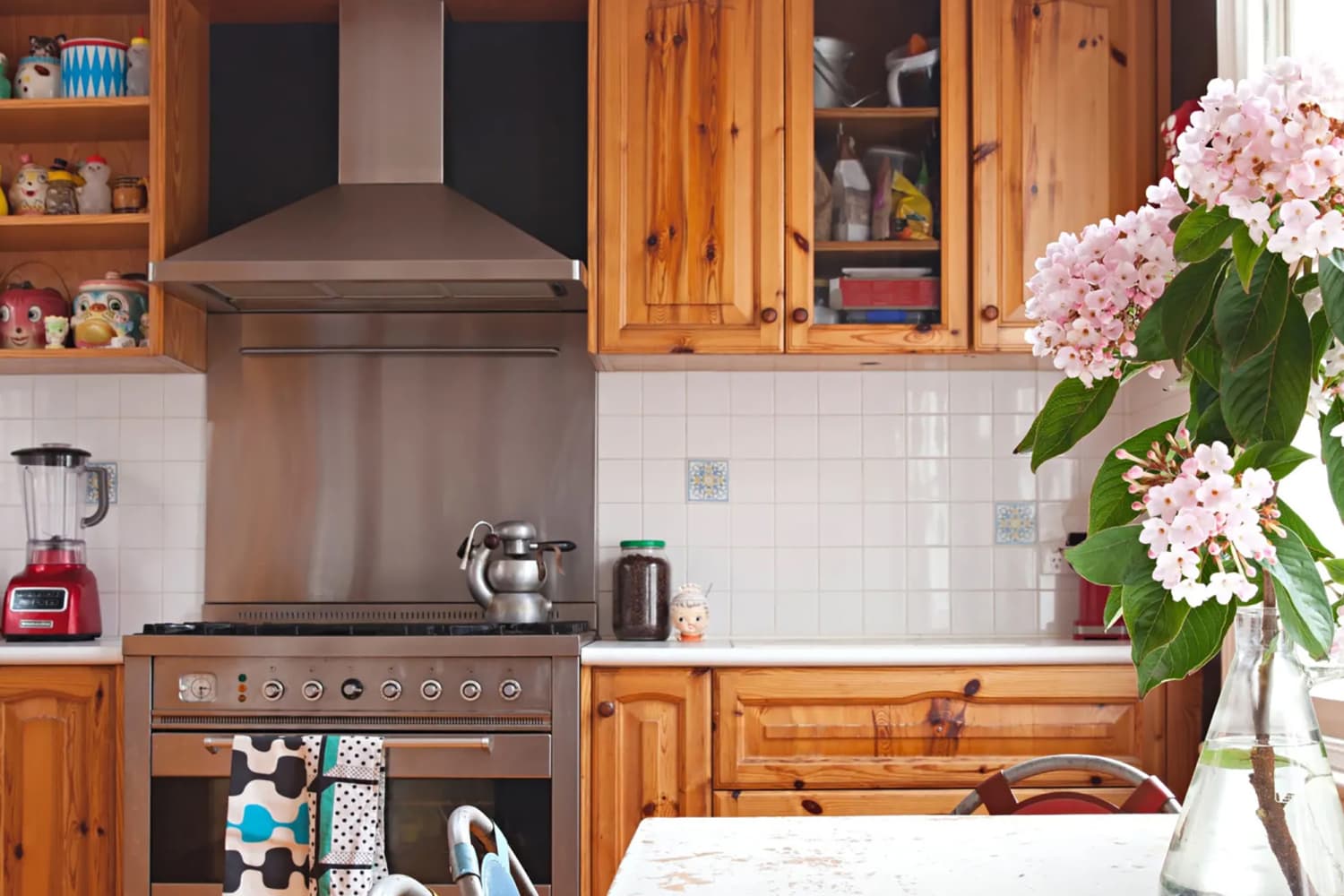 Before & After: Green Cabinets and Pink Backsplash Add Drama to This Dark “Pine Country” Kitchen