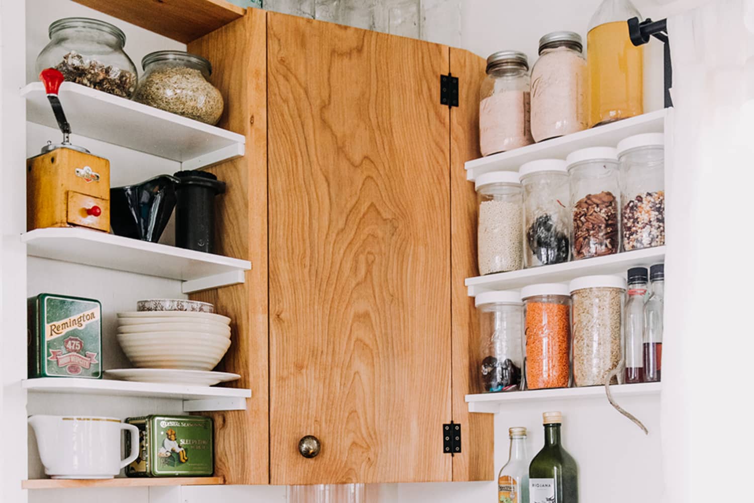 This Ingenious  Organizer Helped Me Free Up Tons of Cabinet Space
