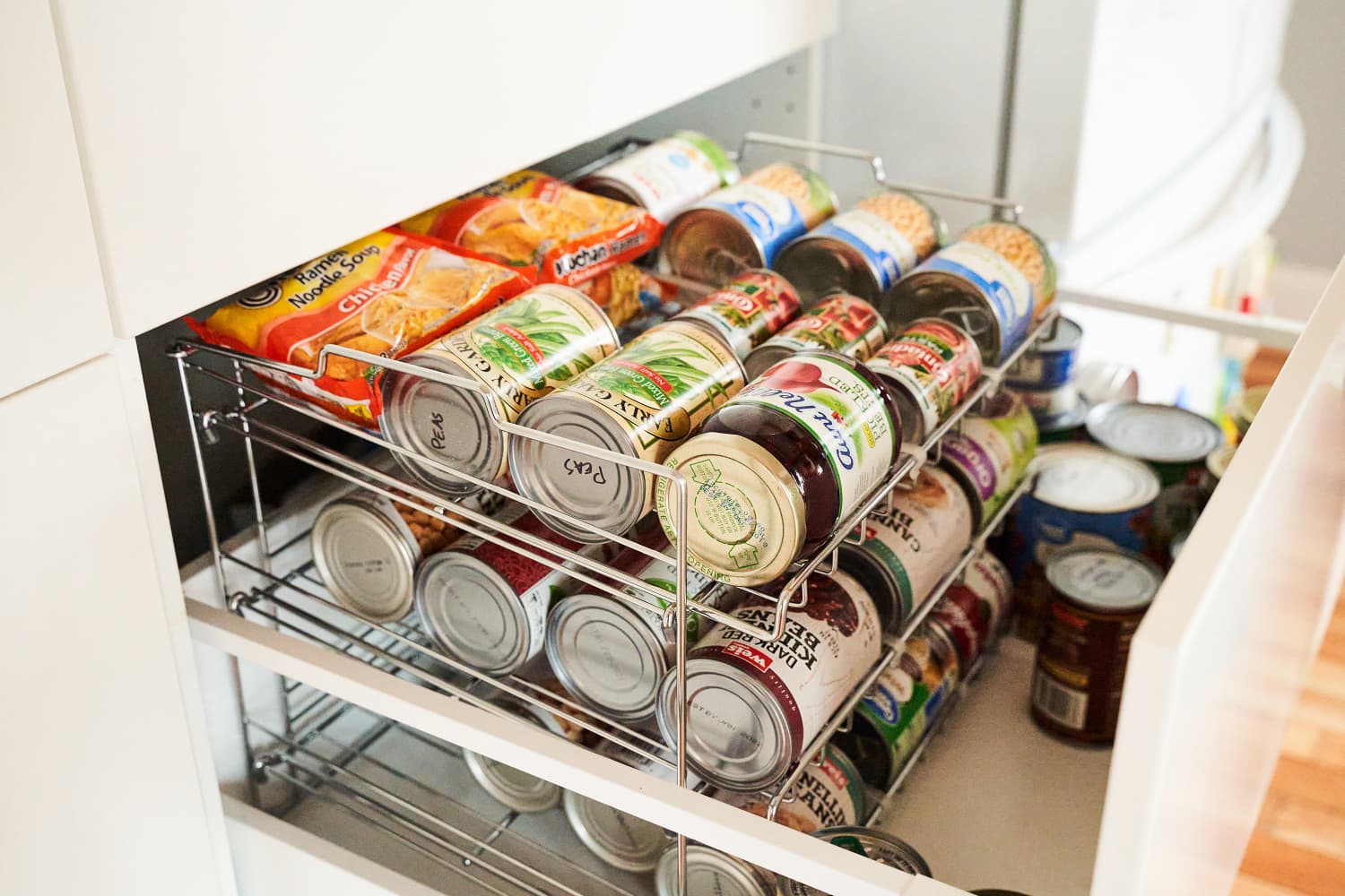 A Very Simple Way To Keep A Tidy Kitchen With Can Organizers