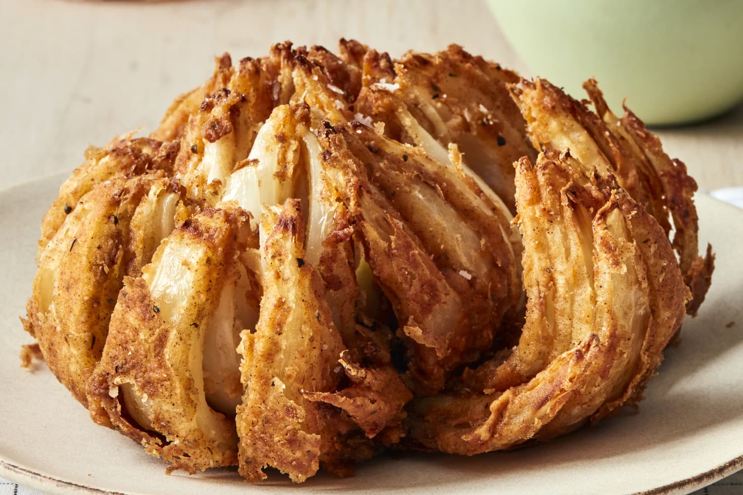 https://cdn.apartmenttherapy.info/image/upload/f_auto,q_auto:eco,c_fill,g_auto,w_1500,ar_3:2/k%2FPhoto%2FRecipes%2F2021-12-blooming-onion%2F211208_ApartmentTherapy_BloominOnion_0230