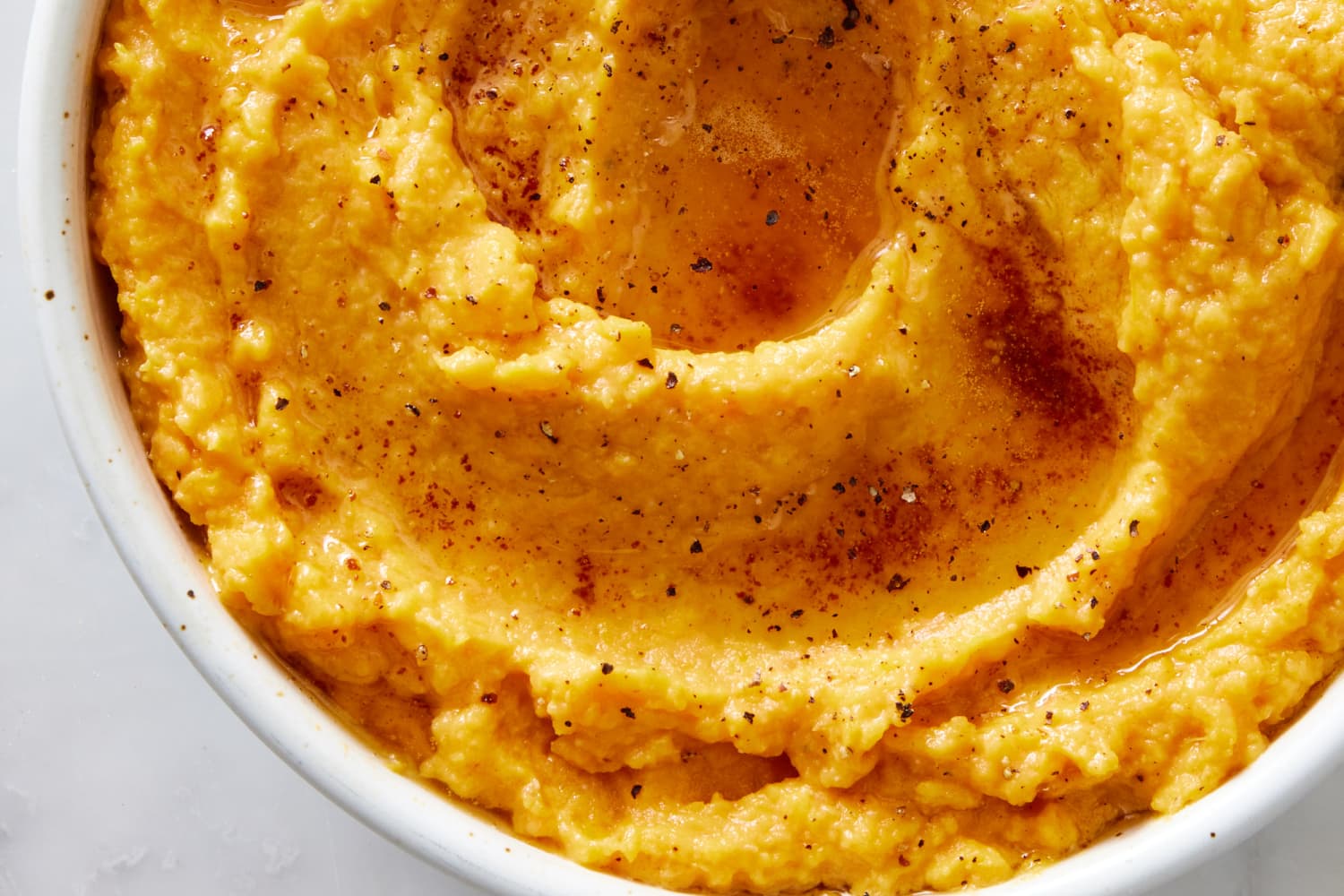 https://cdn.apartmenttherapy.info/image/upload/f_auto,q_auto:eco,c_fill,g_auto,w_1500,ar_3:2/k%2FPhoto%2FRecipes%2F2023-10-brown-butter-mashed-sweet-potato%2Fbrown-butter-mashed-sweet-potato-0038-1