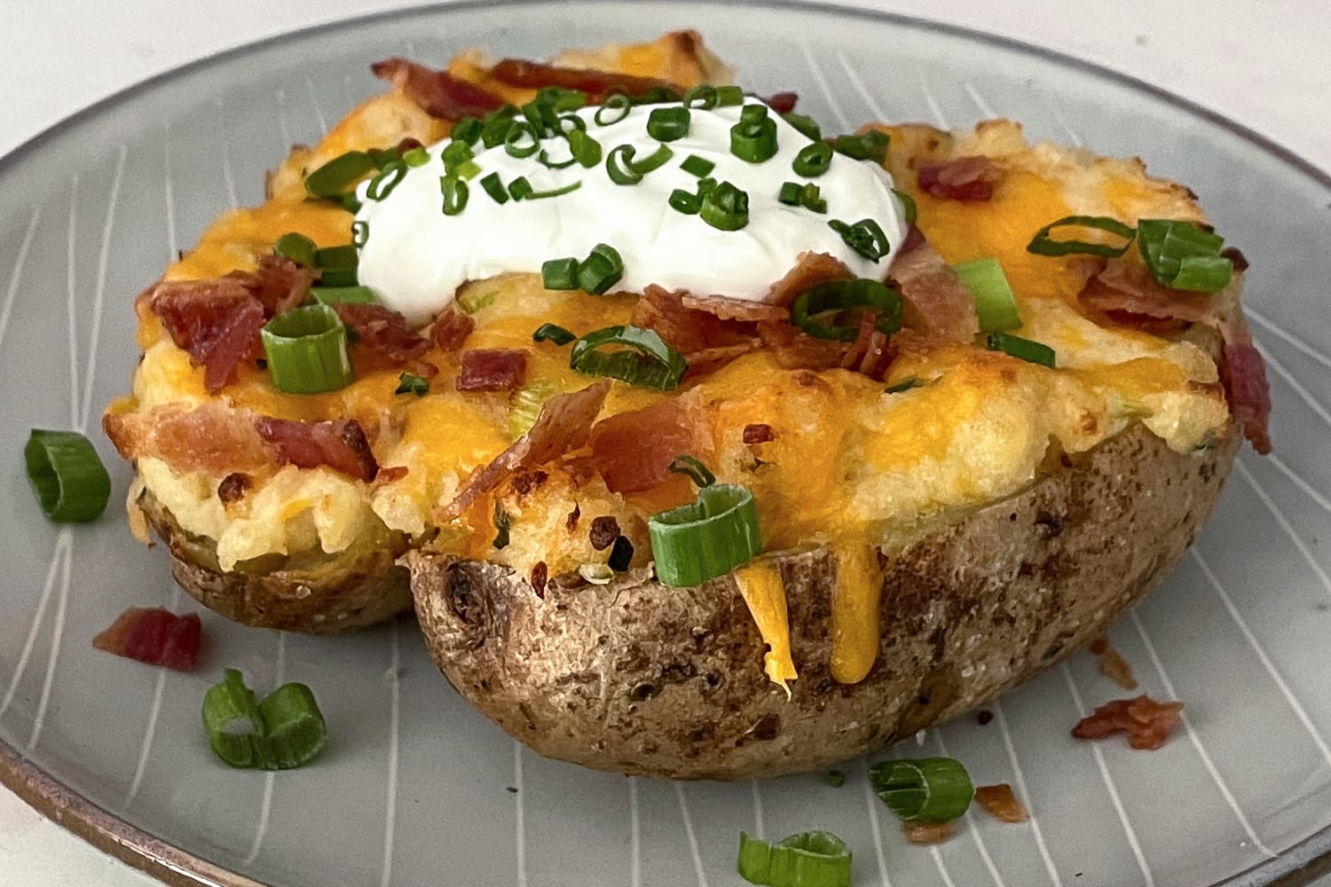 Loaded Baked Potato Recipe (With Lots of Cheese &amp; Bacon) | The Kitchn