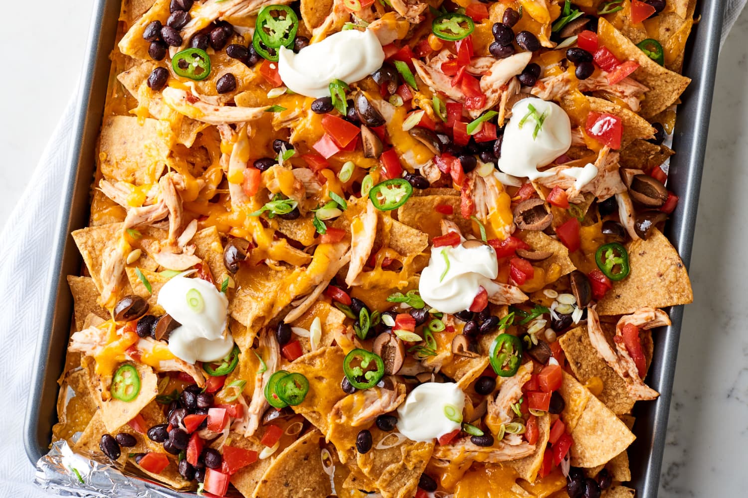 Easy Chicken Nachos Recipe (Using Rotisserie Chicken) The Kitchn