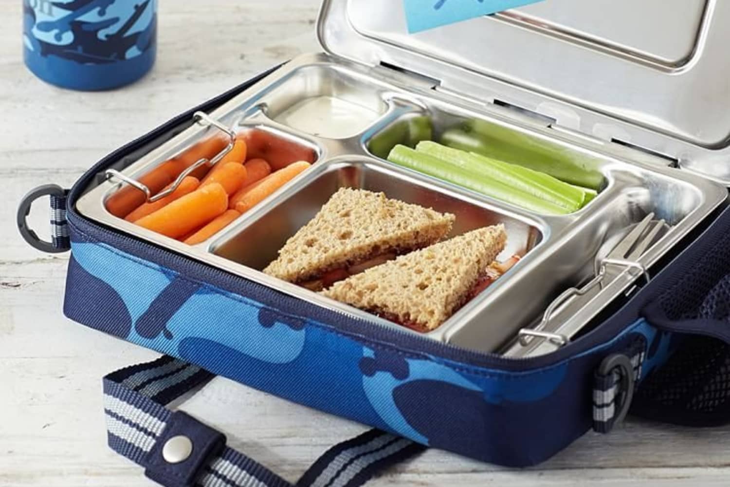 Kids lunch box with strap outlet