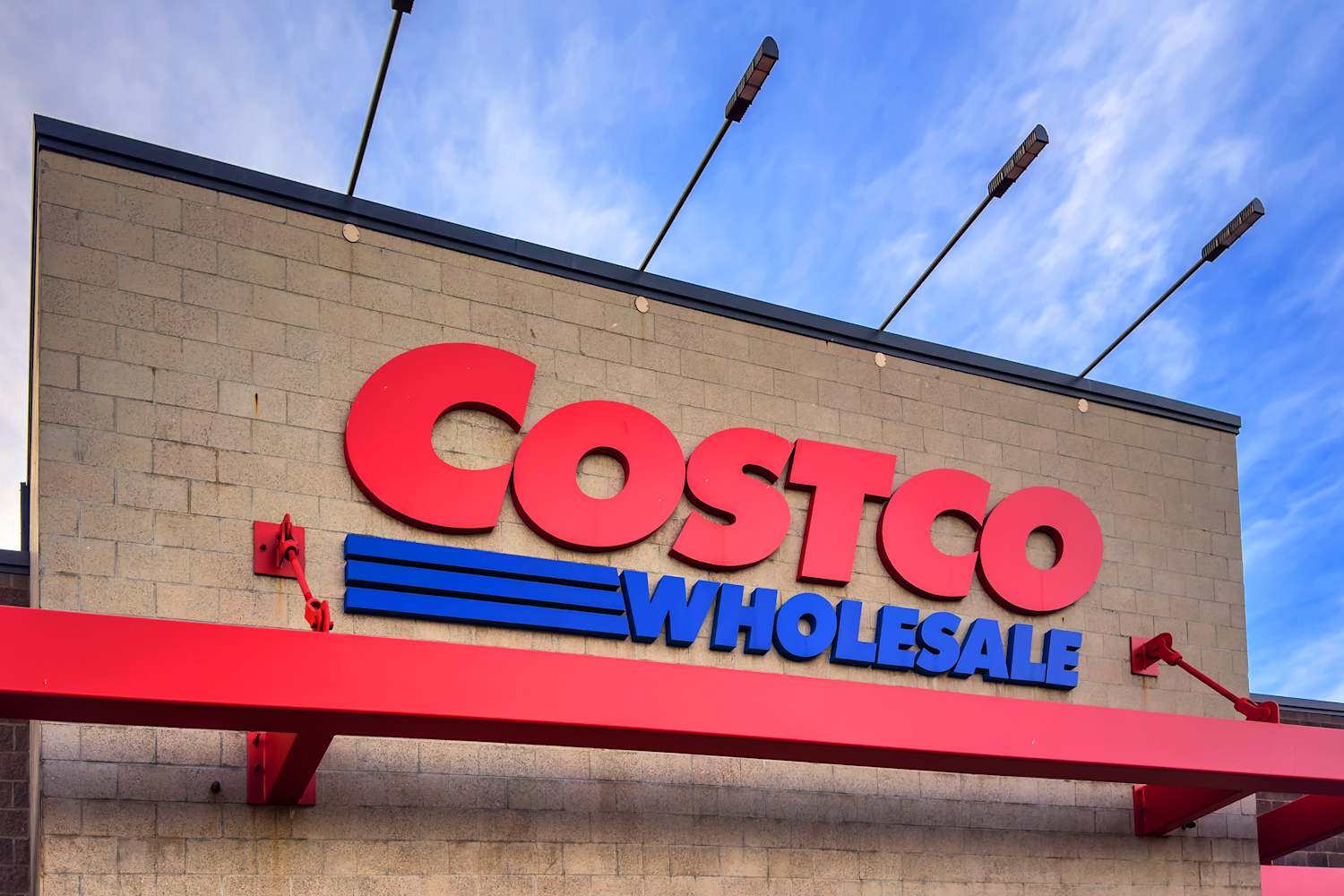 Costco Is Selling the Cutest Cottage Chicken Coop in a Lemon Yellow