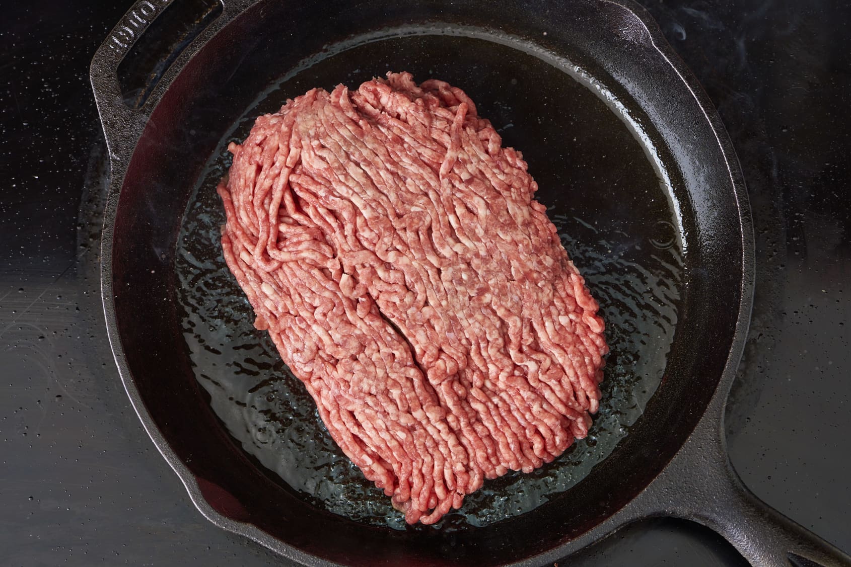A heat-resistant utensil to break up ground beef, stir sauces