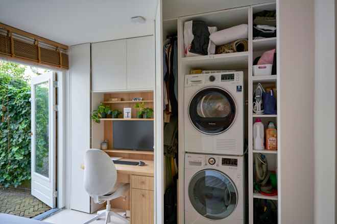 A Designer’s Trick to Making Cabinets Look “Discreet” (It Involves Artwork!)