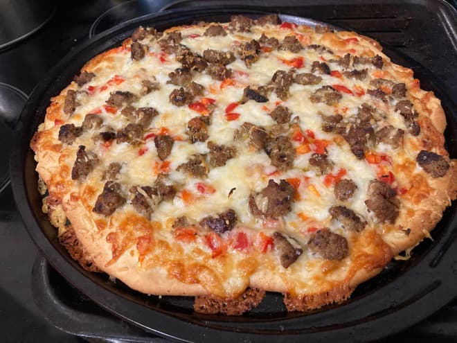 Le Creuset Just Dropped a Pizza Stone That Makes It Easy to Make Pizzeria-Quality Pies at Home