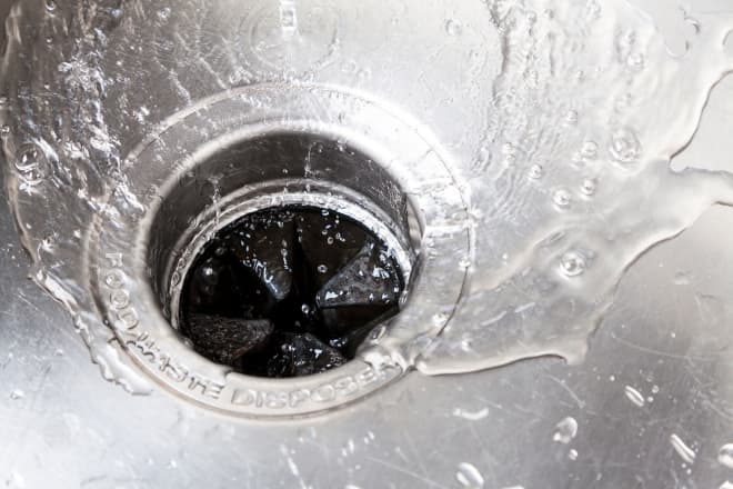 GettyImages-171366298 4 Easy Ways to Clean a Garbage Disposal, According to Plumbers