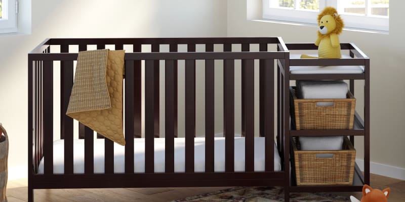 Cot with built in change table outlet