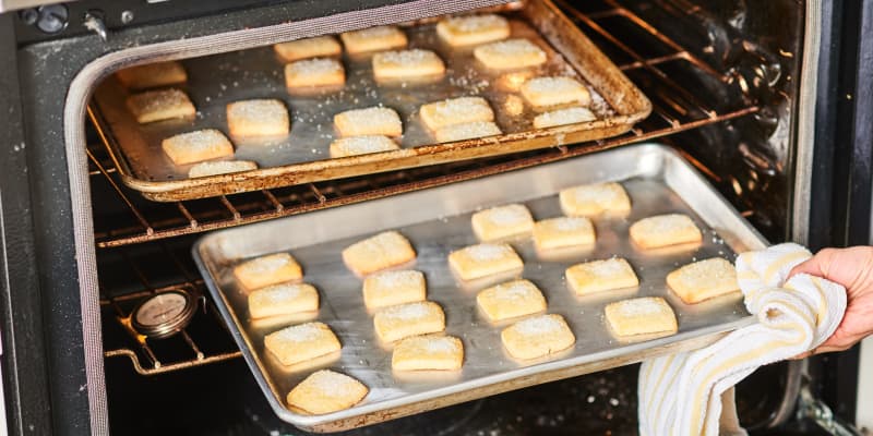 Here's Why Sheet Pans Pop In The Oven And How You Can Prevent It