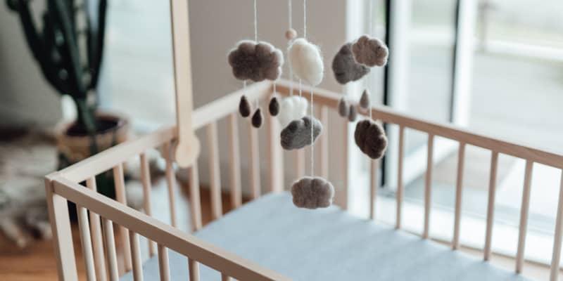 Baby toy hanging hotsell above crib