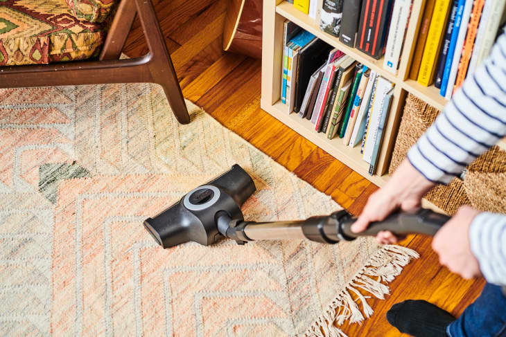 vacuuming area rug at home