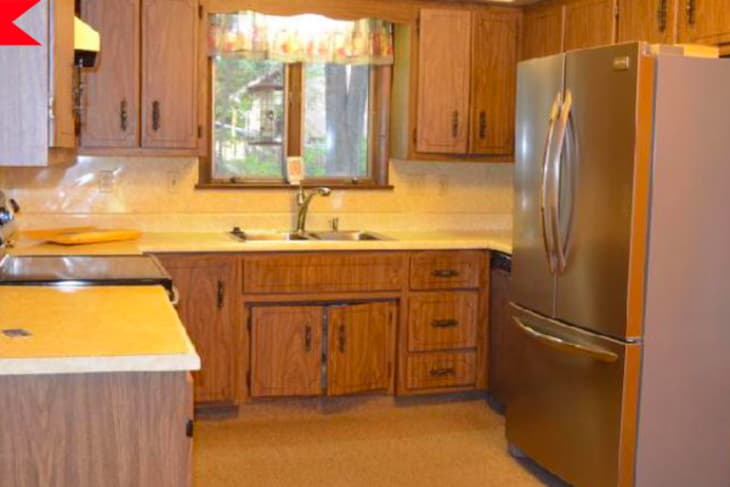 Before: dark wood kitchen with beige counters