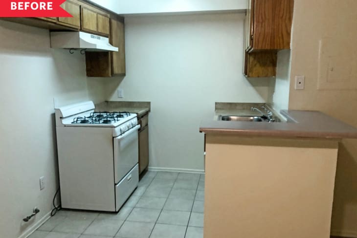 Before: Bare kitchen with dark wood cabinets