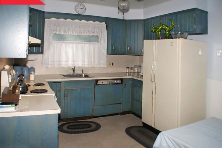 Before: Kitchen with wooden cabinets stained blue