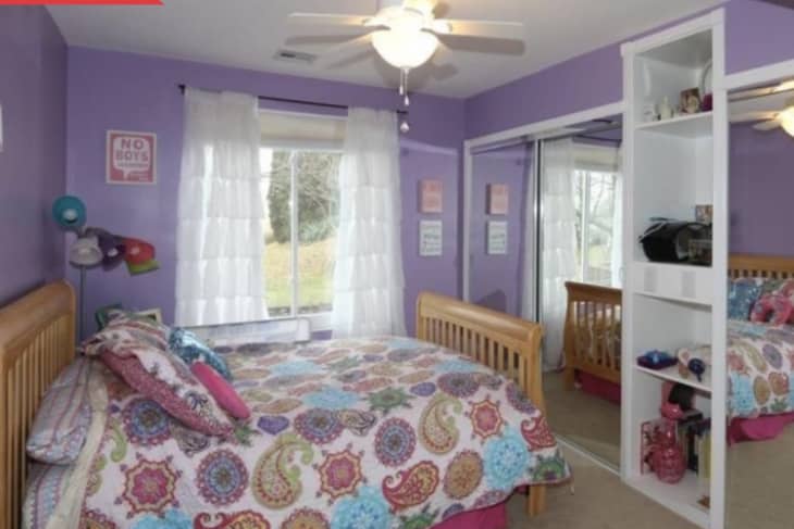 Before: Small kid's bedroom with purple walls and mirrored closet doors