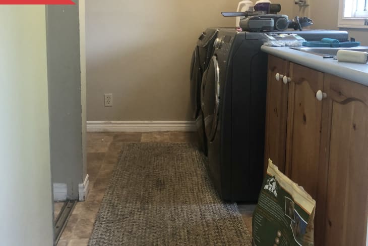 Before: green laundry room with small closet and wood cabinets