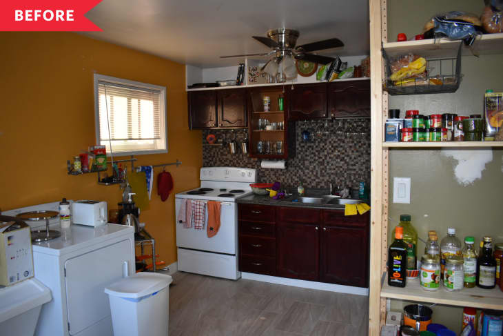 Before: Dark kitchen with dark wood cabinets, orange wall, ceiling fan, and mosaic tile backsplash