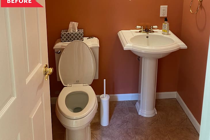 Before: Half bathroom with dark orange walls, white pedestal sink, and beige floors