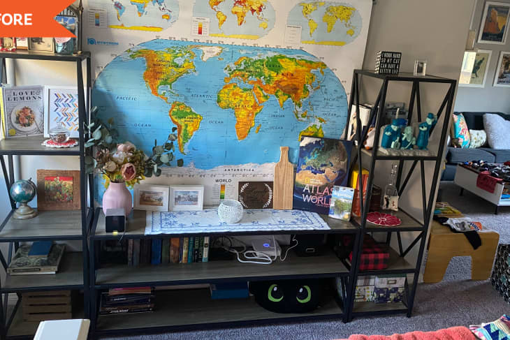 Before: A large shelving unit in front of a map