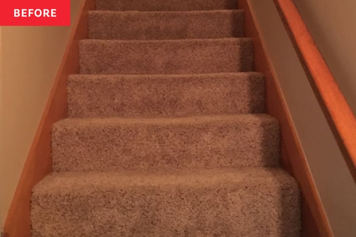 Before: gray carpeted stairs with a brown wooden railing