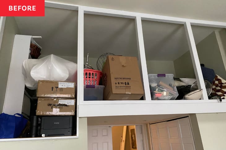 Loft space full of boxes before being renovated into nursery