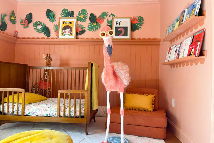 A large stuffed flamingo in the a renovated nursery.