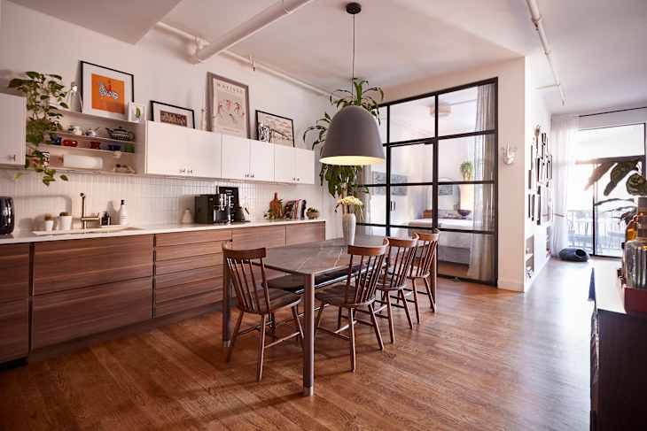 Marble top dining room table in kitchen.