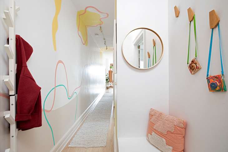 A hallway with painted accent.